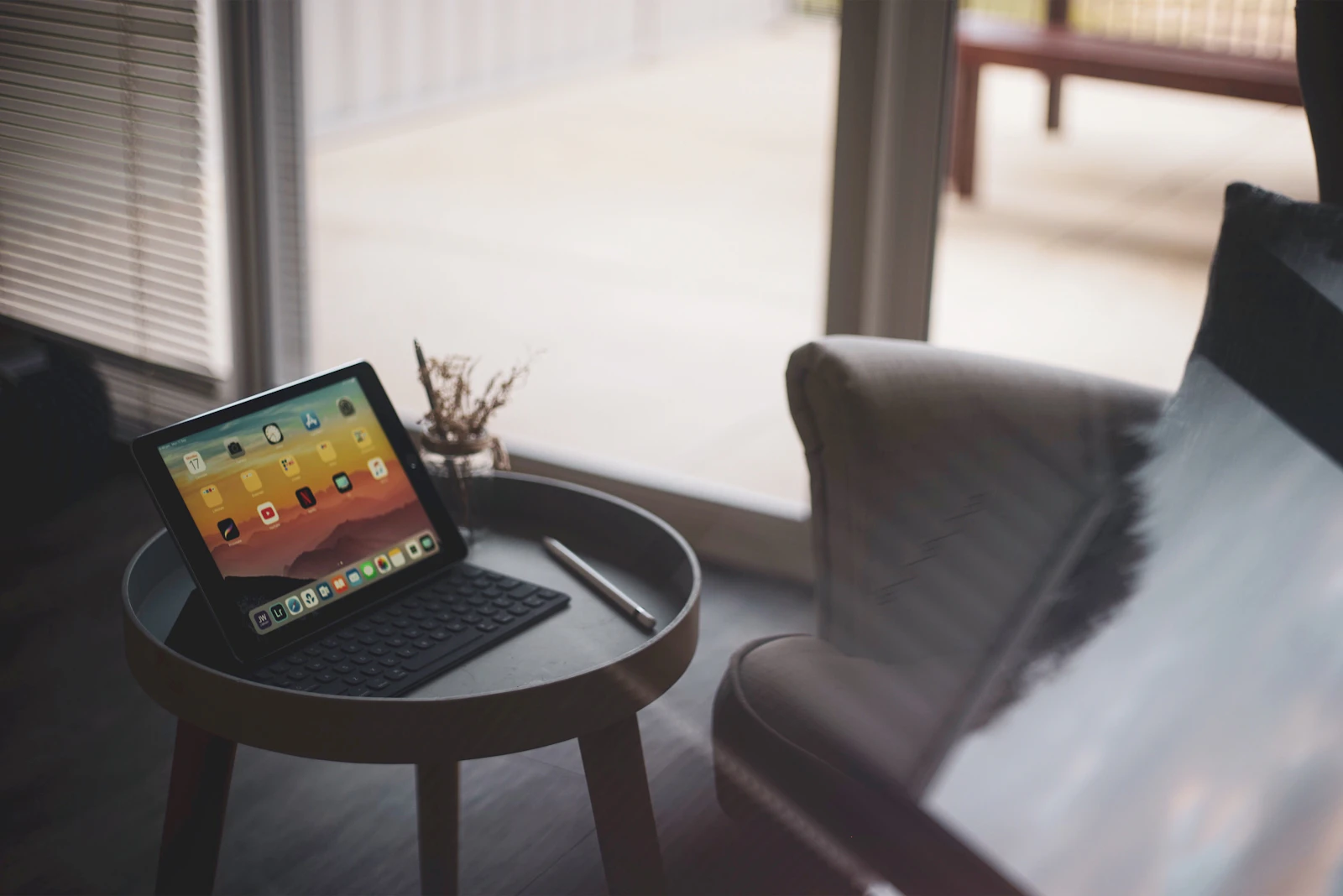 An iPad on a side table showing the movie library of the Duo Smart TV App